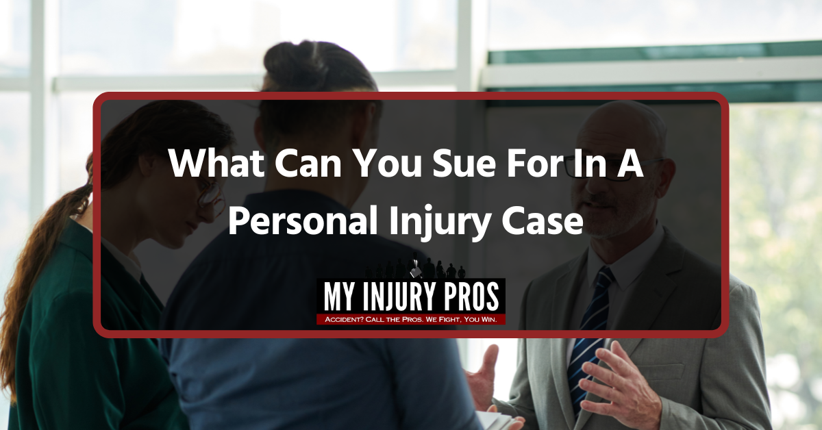 Injured person meeting with a lawyer at a desk to discuss What Can You Sue For In A Personal Injury Case.